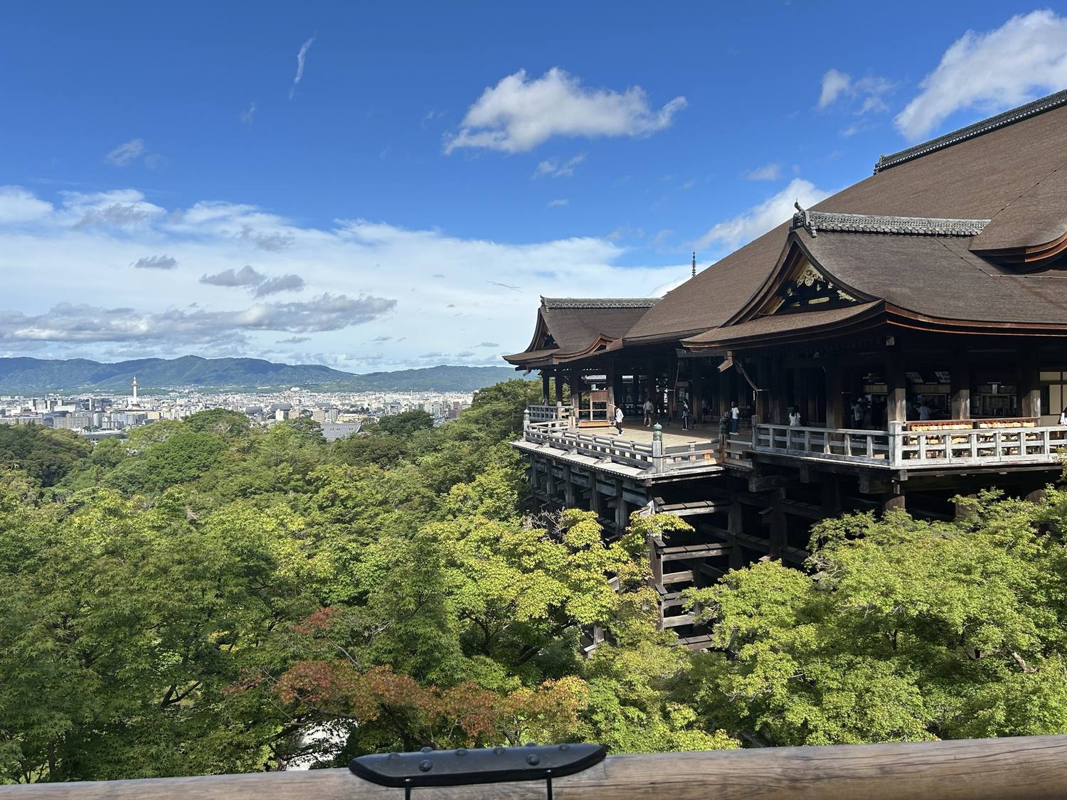 Kiyomizu-dera above the green hills and rooftops of Kyoto